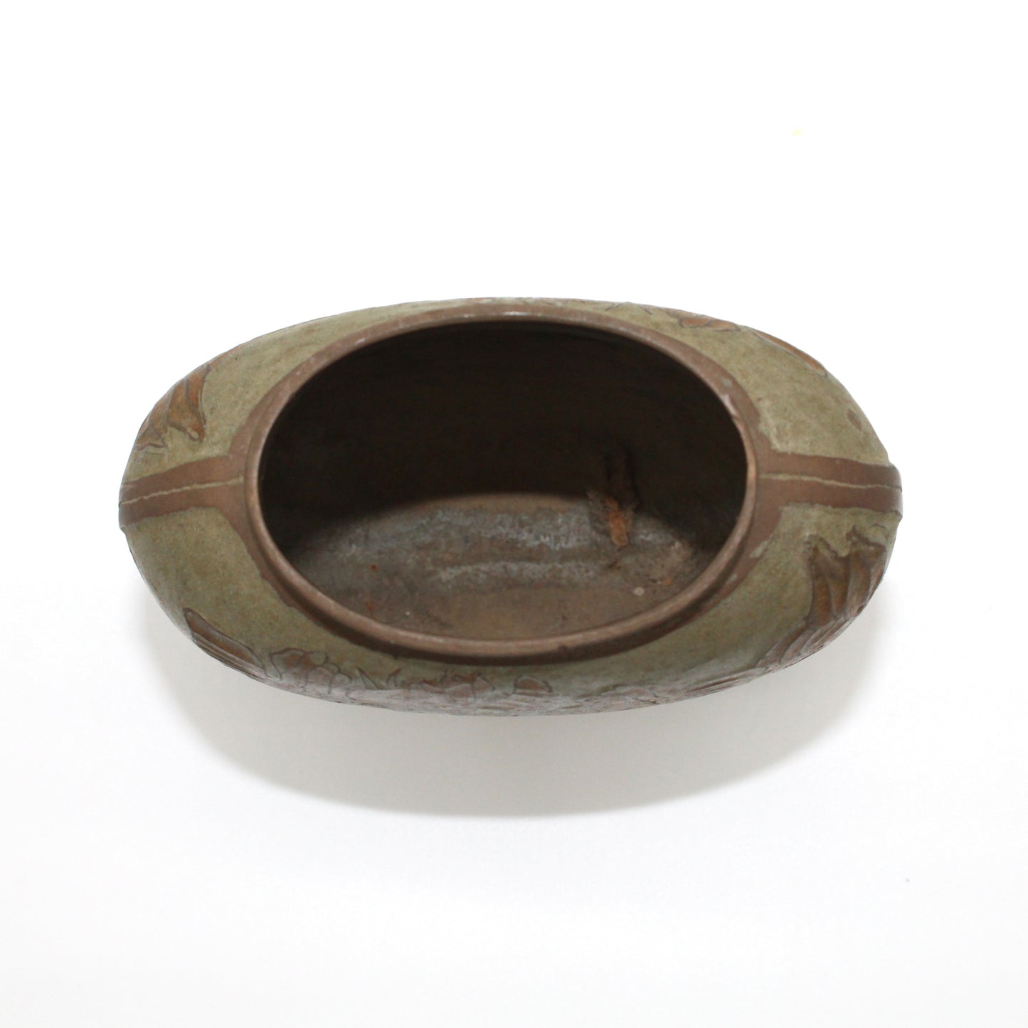 Looking down into brass and enamel vase.