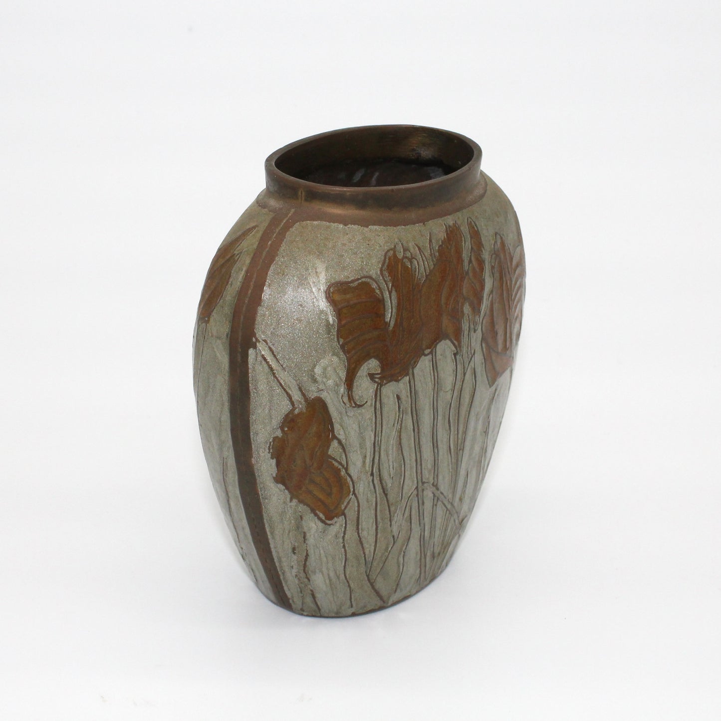 Brass and enamel vase with irises turned to side showing coppery seam down side of vase.