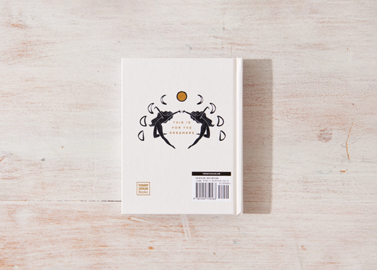 Book with a cover design on a wooden surface