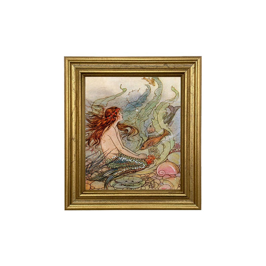 Mermaid Wishes print in golden wood frame on white background.