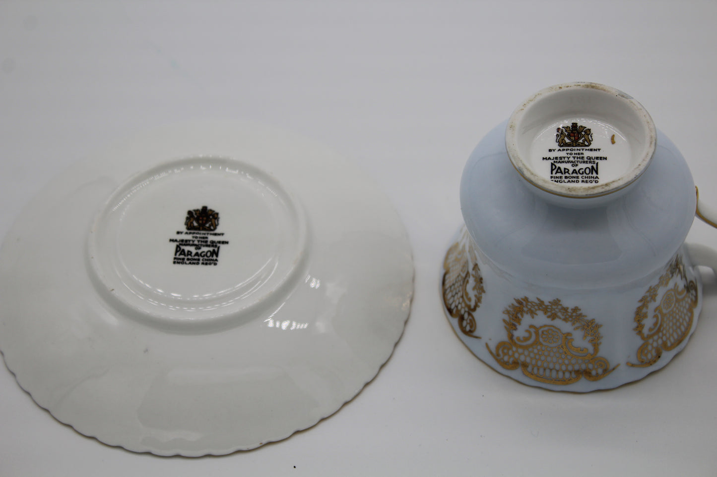 Paragon cup and saucer with gold patterns on a white background
