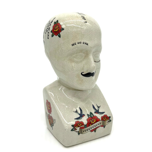 Decorative bust with tattoo designs on a white background