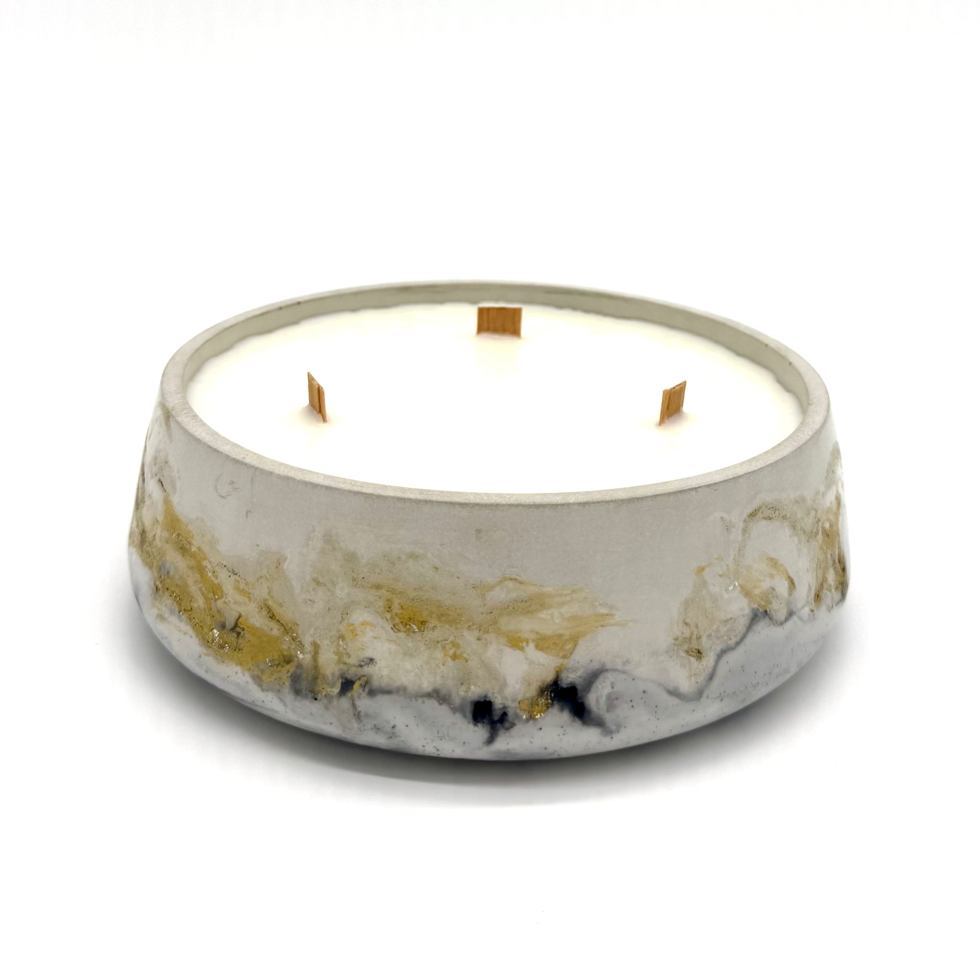 Candle in a decorative container with a marble-like design on a white background