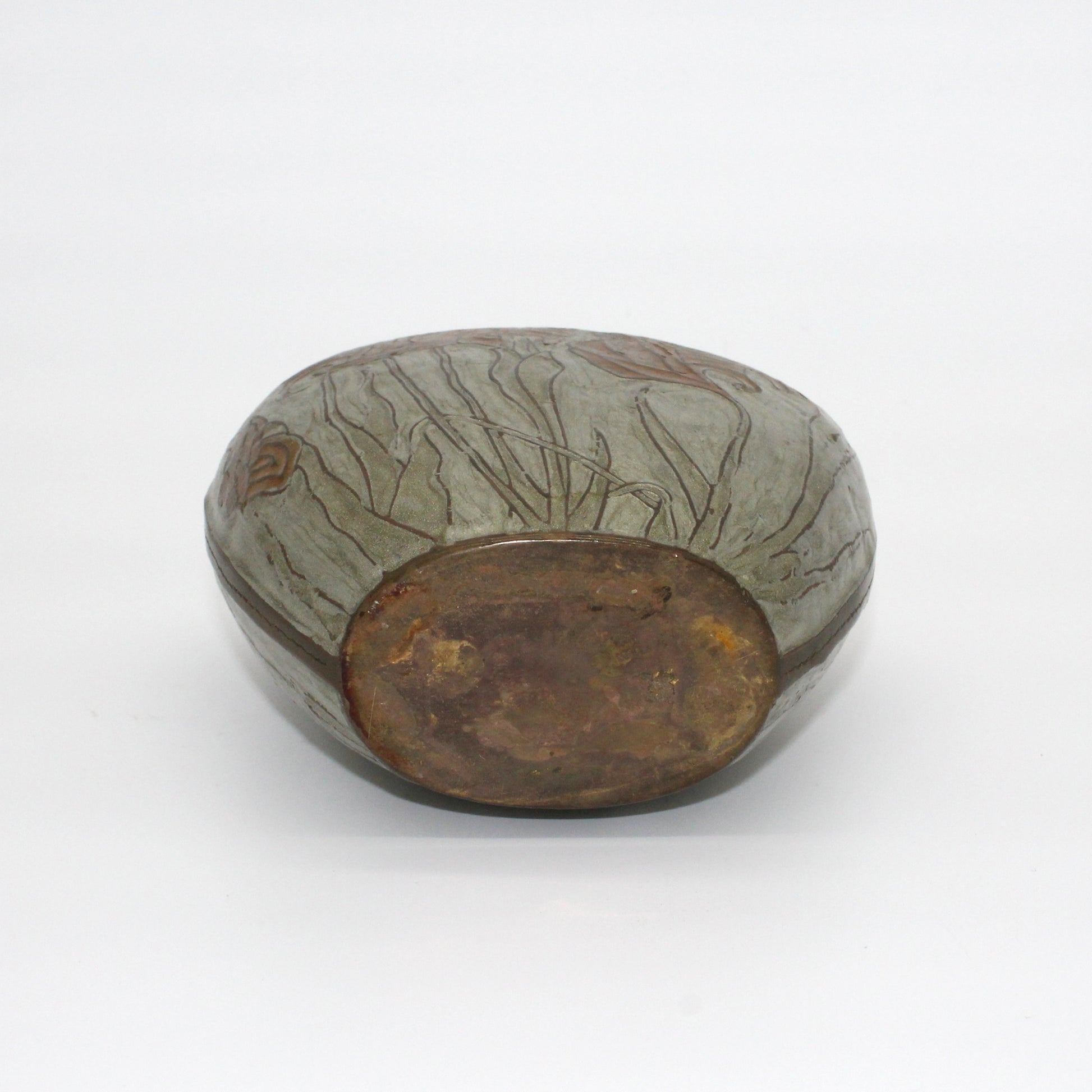 Bottom of decorative bass and emanel vase.
