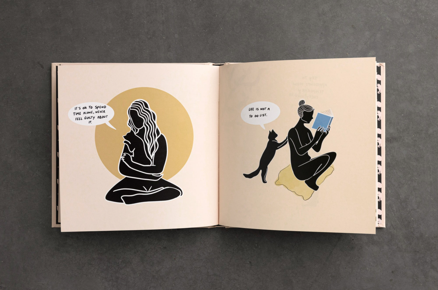 Open book with illustrations of a person and a cat on beige pages against a dark background