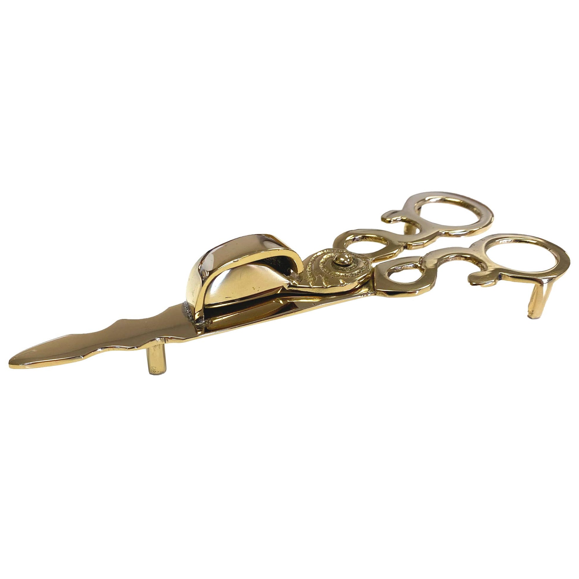 Decorative gold candle snuffer scissors -side view with legs on white background.