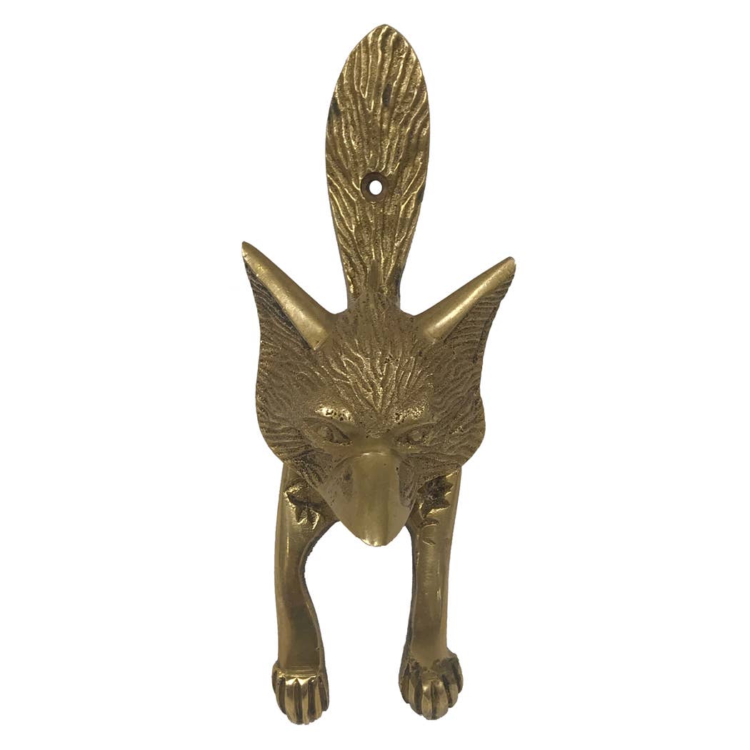 Brass door knocker shaped like a fox on a white background