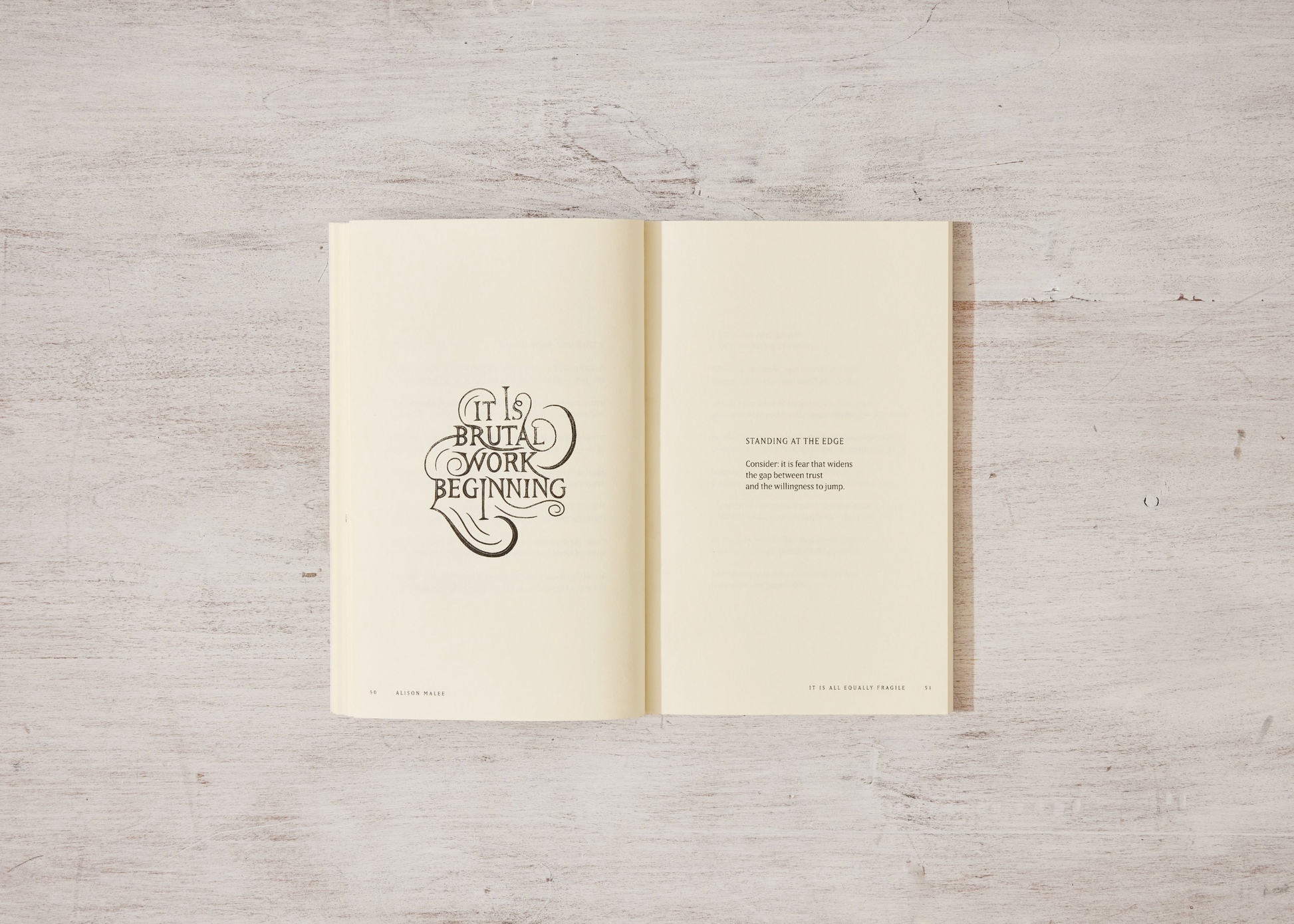 Open book with text on a wooden surface