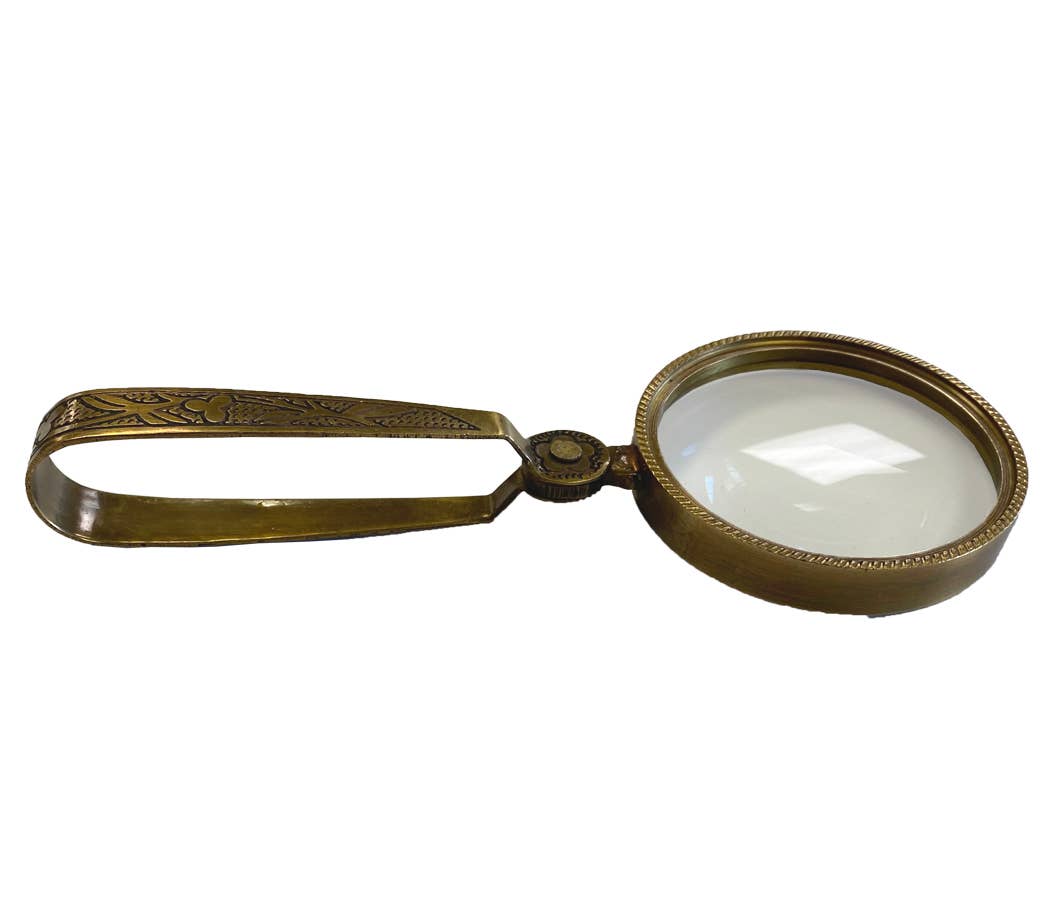 Vintage-style magnifying glass with ornate handle on a white background