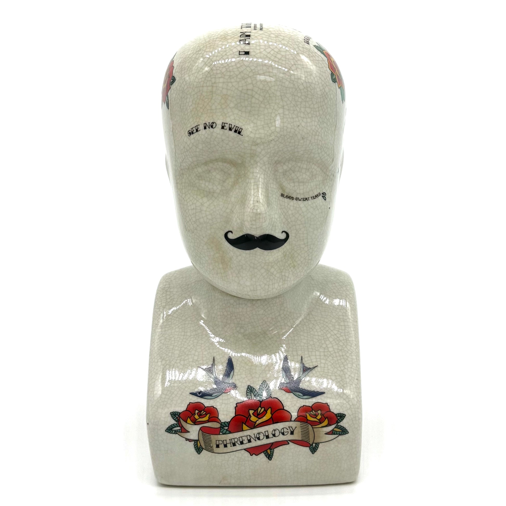 Mannequin head with tattoo designs on a white background