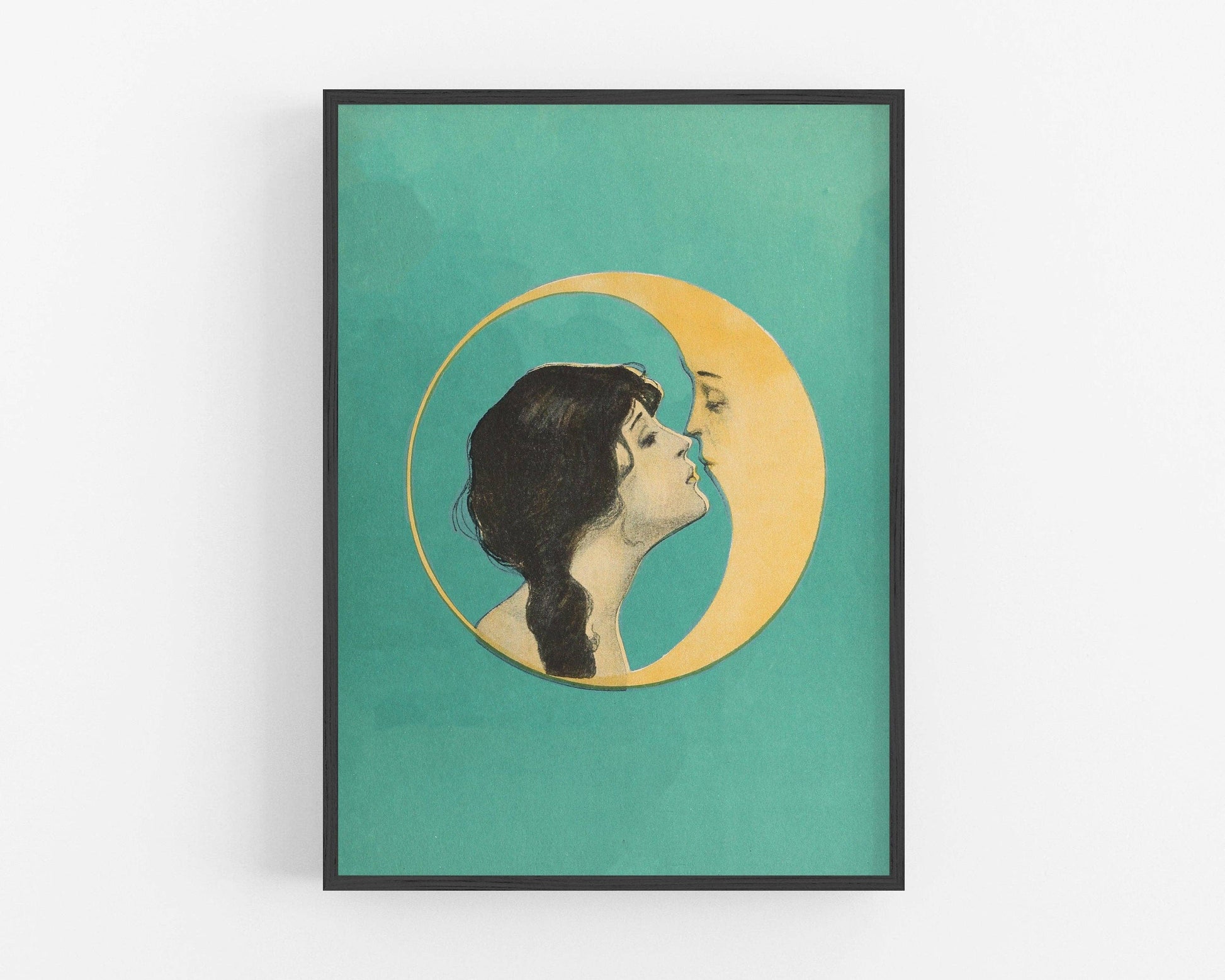 Framed artwork of a woman kissing a crescent moon on a teal background.
